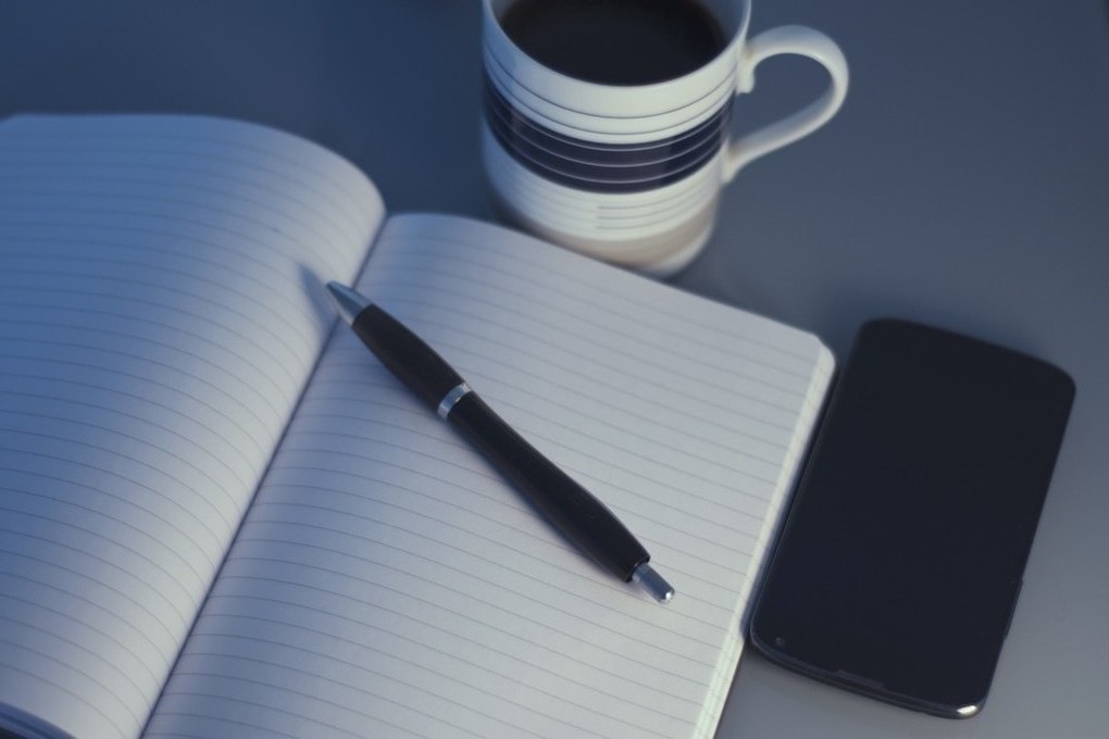 Notebook and soft light suggesting printable awareness worksheets